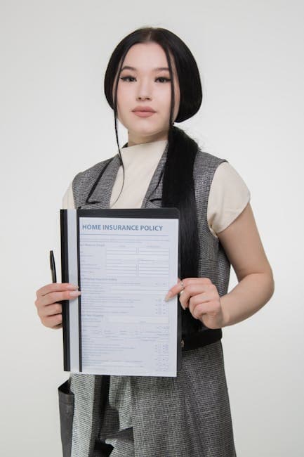 Confident woman holding a home insurance policy to showcase coverage details.