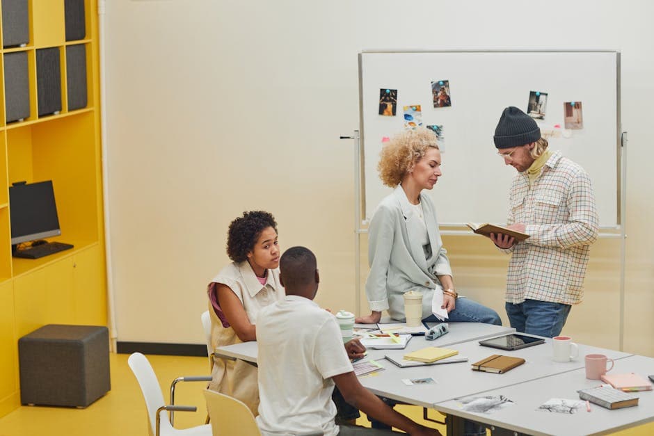 A group of diverse coworkers collaborating on a project in a modern office setting.